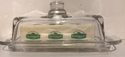 A beautiful clear class butter dish that has been in the family for many years (?).