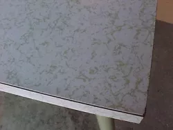 vintage 1960s green and white formica table and 2 green floral print chairs,it measures 4o inches in length by 25...