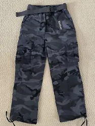 Nathan Cargo Pants. Color: Black/Gray Camouflage. The pants are classic cargo pants with flap cargo pockets.