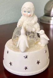 The Snowbabies Music Box rotates and plays 