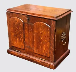 This box is decorated with a very pleasing double tombstone drop front panel with lambs tongue molding along the edges....
