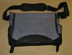 Its sized at 17” wide, 12” tall and 4” deep. Weights 2lbs. has all working zippers and handles. Has a 27”...