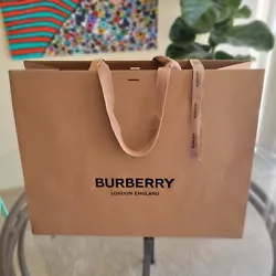 Never used Authentic Burberry Brown Shopping Bag. Extra large, comes with a yard of authentic Burberry ribbon