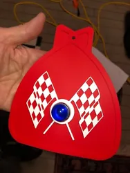 MUDFLAP IN RED WITH RED & WHITE CHECKERED CROSS FLAGS AND BLUE JEWEL. YOU GET ONE MUDFLAP IN RED. WITH CHECKERED CROSS...