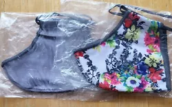 Two Norwex Reusable Adult Size Face Masks with Bacloc. One gray, one floral.