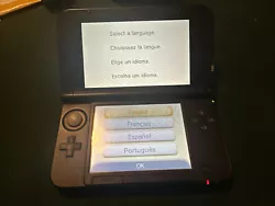 Nintendo 3DS XL Handheld console with charger and case.