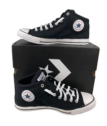 Converse Chuck Taylor All Star circle logo on inner ankle. Converse All Star logo on tongue. Canvas material upper....