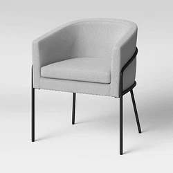 •Upholstered barrel chair makes a chic addition to your home •Black metal frame offers polished appeal and...