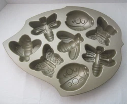 Nordic Ware Backyard Bugs Baking Pan Non Stick Cast Aluminum Made in USA.  5 cup capacity, includes 3D bug shaped mini...
