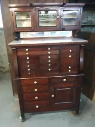 Antique Solid Wood Dentist Sterilizer Cabinet. Cabinet is solid, and in good condition. Finish appears to be original,...