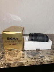 Please note the exterior coating is wearing which is leaving a sticky texture. This Sigma UC Zoom lens with a focal...