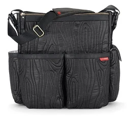 DUO Edgewood features a soft, lightweight material with wood grain quilting, gold hardware and faux leather trim....