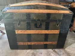 This antique trunk exudes charm and character, with its unique design and sturdy build. Crafted to last, this piece...