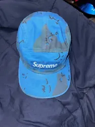 This Supreme Overdyed Camo Nylon Camp Cap is a must-have for any fan of the brand. With a stylish blue camouflage...