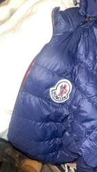 Elevate your winter wardrobe with this stunning Moncler mens puffer jacket. The luxurious blue nylon exterior exudes...