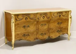 A French Provincial style triple dresser by Romweber Furniture, from their Marquise Collection. Solid wood painted an...
