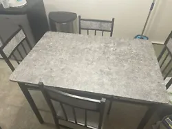 dining table and chairs for 4. Condition is Used. Shipped with USPS Ground Advantage.