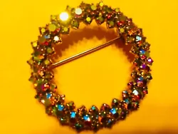 Vtg Aurora Borealis Austrian Crystal goldtone circle pin. This is the flashiest pin I have ever seen. It is about 1...
