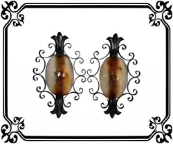 This is a wonderful, large and rare pair of wall sconces made of Murano glasses and wrought iron. The two colored...