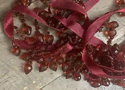 New old stock- 6 yards of Beautiful dark red plastic beaded trim.I’m happy to combine shipping on multiple listings....