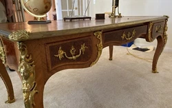 Used desk, but still very beautiful. Not sure on the different types of wood, but i believe there is at least three...