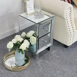 This mirrored glass bedside table with two drawers is sure to add sparkle to your bedroom. Two spacious drawers line...