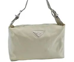 Color Ivory. Style Shoulder bag. Material Nylon. Pocket Inside Pocket has dingy,rubbed,torn. Others The fabric inside...
