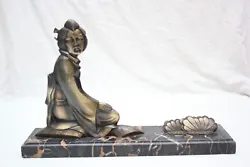 A French Art Déco bronze of a japanese lady with lotus flowers signed by the french artist Paul Berjean Born 1930. Ce...