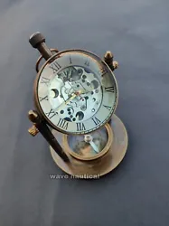 This is Battery operated compass base desk clock. Material: Brass.