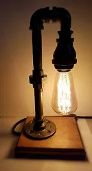 The industrial pipe look adds to the lamp charm and the Edison bulb gives a soft glow for any occasion.