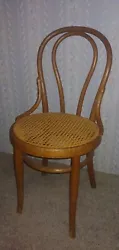 ANTIQUE WOODEN THONET STAMPED CANED CHAIR.