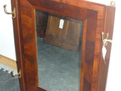 An unusual coat rack mirror with an original, central ogee mirror from 1830 with added mahogany side panels with 4...