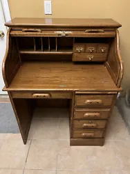 Brown Wooden Roll top Desk With Drawers and shelves, lockable drawer and cover. Working keys, minor use.