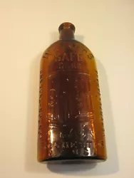 Antique hand blown amber corker bottle embossed Warners Safe Cure with 3 cities, London England, Rochester N.Y. USA and...