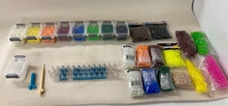 Rainbow Loom Kit with Multiple Rubber Bands (all pictured). 2 Glow in the Dark Bags of Rubber Band. 2 Bags of Beads.