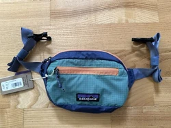 Made with 100% recycled body fabric, lining and webbing. The adjustable strap extends from 8