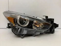 Up for sale is a good working part. It is a right passengers side headlight. This is a genuine authentic OEM MAZDA...