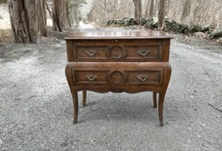 Bombe form, two drawers, carved moldings, and solid cast brass handles. Or PlyconTranportationGroup. Yours truly,...