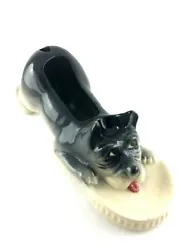 The scottie dog vanity (pipe) tray. The Scottie dog is black and white and has a scoop on top of the head. The hole in...