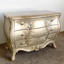 Step into the world of French elegance with the Golden Marble Bombé Chest of Drawers. Boasting a golden painted finish...