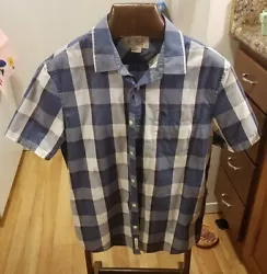 Pre-owned but in excellent shape, blue, white and purple plaid.
