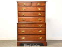 A high quality 1960s solid cherry traditional tall dresser with dovetailed drawers and brass hardware by Henkel Harris...