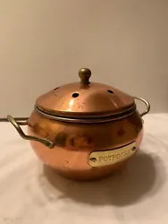 Shiny vintage copper potpourri simmering pot.  Has a secure fitting lid with vent holes and a knob handle on top. ...