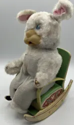 This item is very vintage.  It is a bunny sitting in a rocking chair made of tin.  There are parts missing, the bunny...