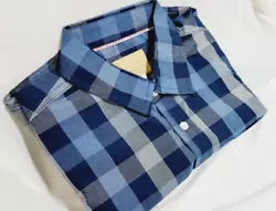 A standard straight cut allows room through the shoulders and chest for a movable fit. The classic button front and...