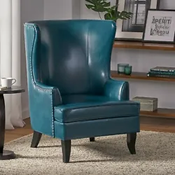 Features wingback sides and nailhead accent. Tall backrest and cushioned seat. Seat 17