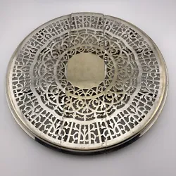 This exquisite Victorian trivet is a true work of art. Crafted from silver deposit on nickel silver, it features a...