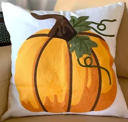 This is a beautifully embroidered throw pillow cover featuring a pumpkin freshly cut off the vine, with green leaves...