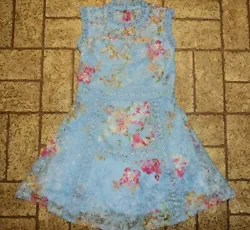 Pretty Easter dress by Knit Works. With full 3 layered skirt with netted ruffle slip and sheer lacy top layer.