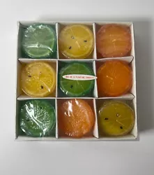Set of nine vintage citrus lemon, lime, and orange floating candles made in the 1990s or early 2000s. Each candle is...